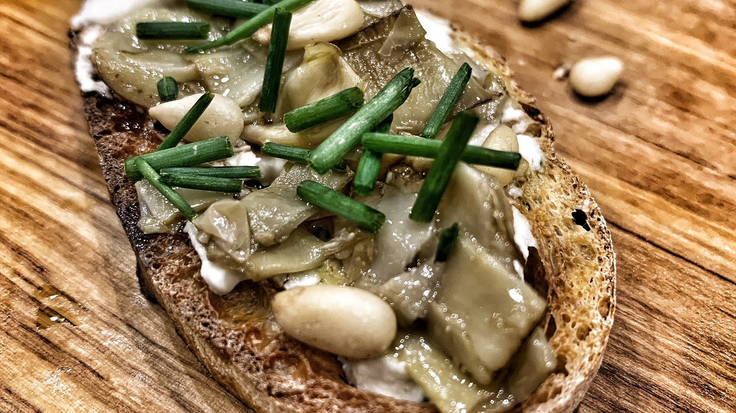 Artichoke Crostini with Cheese and Pine Nuts