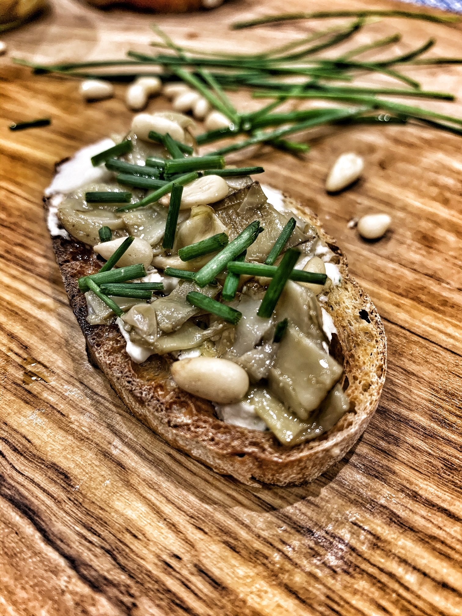 Artichoke Crostini with Cheese and Pine Nuts